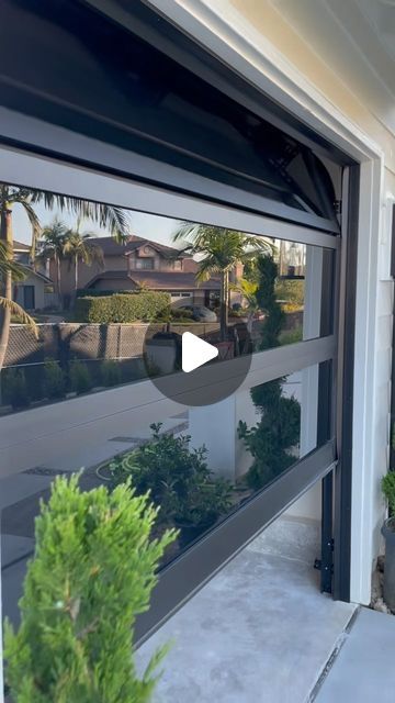 Optimize - Garage Door on Instagram: "Homes Curb appeal goes 🔥  With New Glass Garage Doors ✍🏻   Request a garage door quote  @optimizegaragedoors 📲   #homeinspiration #decohome  #luxuryhome #homedesign  #contractors #car #instagood" Enclosing Garage Door Opening, Clear Garage Door Patio, Transparent Garage Door, Glass Garage Doors In House, Garage Door In Kitchen, Garage Man Door, Modern Garage Design Interior, Modern Garage Doors Ideas, Garage Doors Glass