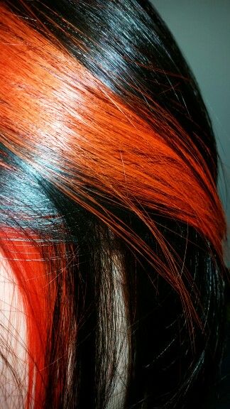 Orange and black hair Black Hair Orange Streak, Black Hair Orange Highlights, Orange Highlights In Black Hair, Black Hair With Orange Highlights, Black And Orange Hair, Orange And Black Hair, Arcane Oc, Hair Ritual, Hair Color Placement