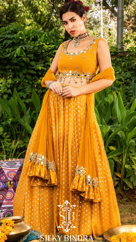 SILKY BINDRA mirror work lehenga set with scalloped blouse  #silkybindra #fashion #style #mirrorwork #lehenga #indianwedding #indianfashion #wedding #mehendi #shopping #buynow Haldi Costume, Georgette Frocks, Lehenga Shoot, Mirrorwork Lehenga, Lehnga Style, Walima Outfit, Mirror Tassels, Bridal Choli, Kanjipuram Saree