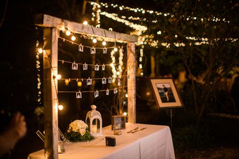 Polaroid wedding guestbook with fairy lights and vintage key bottle opener name and seating tags Polaroid Photo Wedding, Table Centerpieces Wedding Candles, Wedding Photo Walls, Polaroid Wedding, Candle Table Centerpieces, Wedding Photo Display, Pictures On String, Photo Walls, Key Bottle Opener