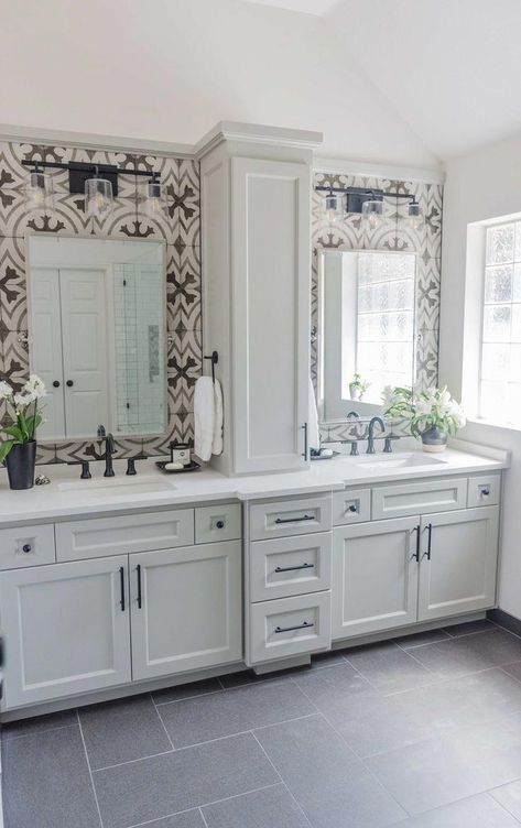 BEFORE AND AFTER - Master bathroom remodel with cement look tile, black faucets and cabinet on top of vanity | Carla Aston, Designer | Charles Behrend, Photographer #cementtile #blackfaucets #doublevanity #bathroomremodel Black Faucets, Makeover Kamar Mandi, Cement Look Tile, Bathroom Vanity Designs, Herringbone Backsplash, Bad Inspiration, Master Bath Remodel, Vanity Design, Bathroom Renos