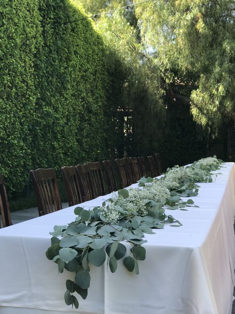 Silver dollar eucalyptus and million star baby’s breath garland set this 32 ft. Long wedding banquet table! Wedding Decor Eucalyptus, Garden Entertaining, Eucalyptus Wedding Decor, Eucalyptus Centerpiece, Wedding Table Garland, Long Table Wedding, Artificial Eucalyptus Garland, Table Garland, Majlis Perkahwinan