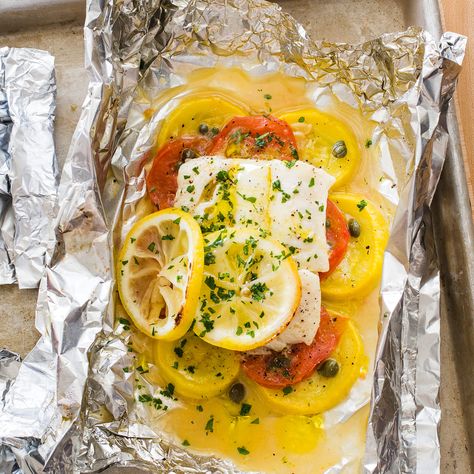 Summer squash and tomatoes cook at the same rate as the fish. An easy microwave garlic oil adds depth. Grilled Cod, Tomato Relish, Cooking Tomatoes, Grilled Dinner, America's Test Kitchen Recipes, Garlic Oil, Weekend Meals, America's Test Kitchen, Americas Test Kitchen