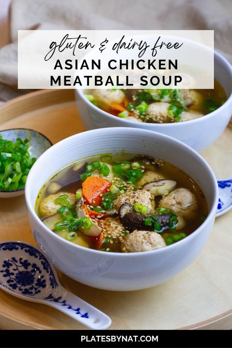 Front shot of two bowls of soup with chicken meatballs and vegetables. Asian Meatball Soup Recipes, Asian Chicken Meatball Soup, Chinese Meatball Soup, Asian Meatball Soup, Chicken Meatball Soup Recipes, Chicken Meatballs Asian, Fluffy Meatballs, Asian Pork Meatballs, Asian Chicken Meatballs