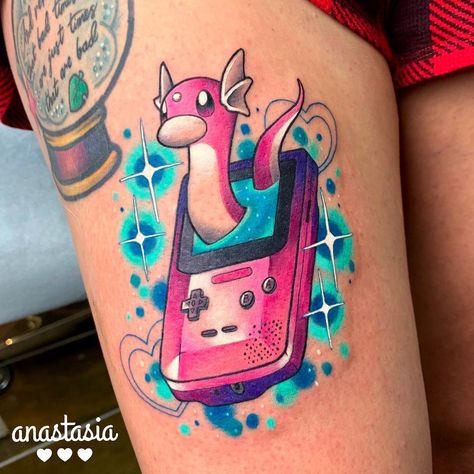 An incredible shiny Dratini Pokemon tattoo by tamagothchick on Instagram. #tattoos #dratini #pokemon #games #gaming #pokemonart #pokemontattoo Dratini Pokemon, Pokemon Sleeves, Natur Tattoo Arm, Blitz Tattoo, Games Tattoo, Video Game Tattoos, Pikachu Tattoo, Nerdy Tattoos, Gamer Tattoos