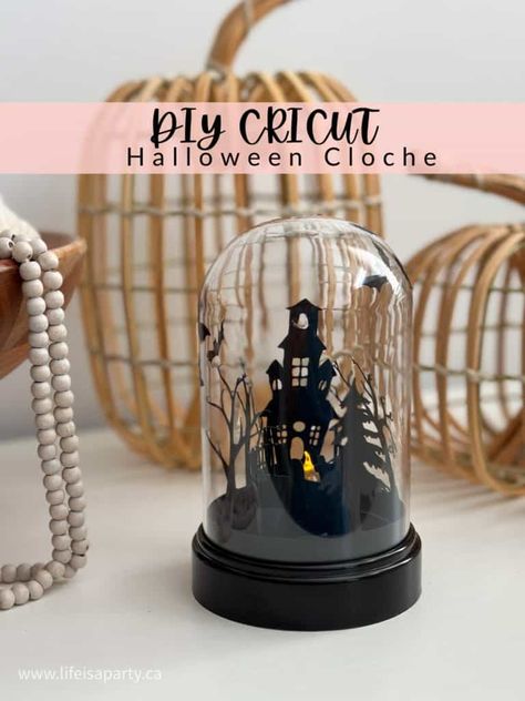 <p>DIY Cricut Halloween Cloche: use dollar store materials to make this haunted house, and graveyard silhouette cloche for Halloween. It’s halloween and time for all the spooky cute halloween decorations.  This mini halloween cloche is so cute, and really inexpensive to make with dollar store craft supplies.  We used our Cricut machine to cut out...</p> <p>The post <a rel="nofollow" href="https://www.lifeisaparty.ca/spooky-diy-cricut-halloween-cloche/">Spooky DIY Cricut Hallow... Halloween Cloche Ideas Dollar Tree, Halloween Glass Dome Ideas, Cloche Halloween, Creepy Cloche Ideas, Graveyard Silhouette, Skull Cricut, Haunted House Silhouette Dollar Tree, Halloween Cloche, Christmas Cloche