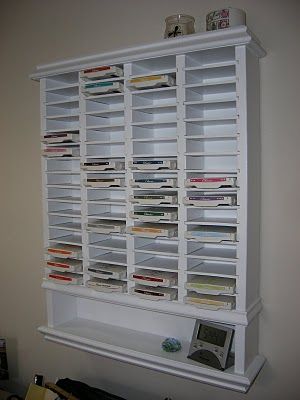 Build your own ink pad storage!  This storage is about 21 ¼ inches wide and 24 ¾ inches tall (without the molding pieces) and can hold 60 ink pads.   Parts list        2          6-foot pieces of ¾ pine      1          4-foot piece of ¾ pine      1          2 x 2 foot piece of ¼ board (backer board)      1          4 x 2 foot piece of ¼ board (shelves) Scrapbook Rooms, Ink Pad Storage, Pad Storage, Crafting Space, Craft Storage Organization, Scrapbook Storage, Scrapbook Organization, Stamp Storage, Dream Craft Room