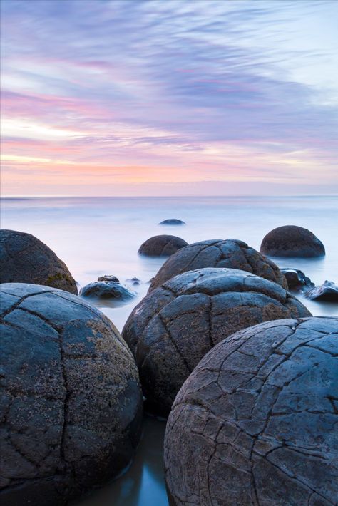 Moeraki, on the east coast of the South Island, south of Oamaru, is known world wide for its famous boulders. The boulders formed over millions of years, but Moeraki has a human history only a few hundred years old. Moeraki Boulders, Nature Colours, Mountain Lakes, Winter Color, South Island, Abstract Nature, Pacific Ocean, Beautiful Islands, Canvas Home