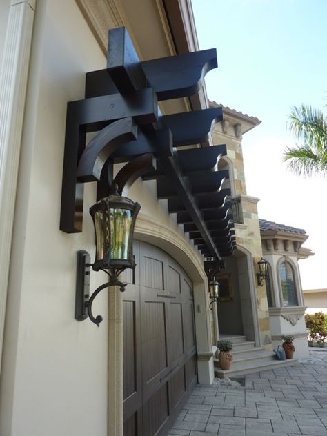 A trellis over a garage door adds a nice  architectural feature to a home. We designed and installed this garage trellis for a client in Naples FL. Architectural Structures of Naples, Inc. www.asoffl.com Garage Arbor, Door Arbor, Pergola Wall, Garage Trellis, Door Pergola, Garage Pergola, Garage Door Makeover, Patio Pergola, Pergola Ideas