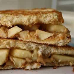 These sandwiches are a simple, but impressive, combination of flavors and textures--apple, peanut butter, cinnamon--perfect for after-school snacking or a quick lunch. Great with a glass of cold milk! Apple Sandwich Recipes, Peanut Butter Apple Sandwich, Peanut Butter Apple, Apple Sandwich, Apple And Peanut Butter, Peanut Butter Sandwich, Wrap Sandwiches, Creamy Peanut Butter, Sandwich Recipes