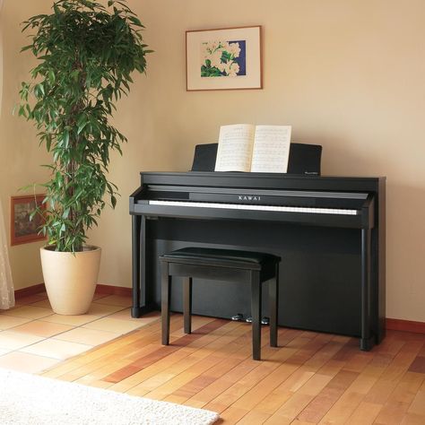 If you haven't tried Kawai digital pianos lately, you'll be astonished by their exquisite sound and feel. A Kawai digital piano is the perfect cultural and educational addition to your home. #kawaipiano #digitalpiano #music #piano #pianogram #musiceducation Piano Corner, Neutral Apartment Decor, Modern Industrial Apartment, Kawaii Piano, Piano Room Decor, Piano Living Rooms, Piano Table, Piano Stand, Home Office Layouts