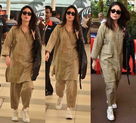 Kareena Kapoor was snapped at the airport recently wearing a cotton kurta set paired with white sneakers. She carried a black leather jacket over her shoulders and finished off her look with a pair of sunglasses, minimal makeup and straight hair! Kurti With Sneakers, Kurta With Sneakers, Cotton Kurta Set, Indian Celebrity, Vintage Shirt Dress, Pakistani Fashion Casual, Casual Indian Fashion, Pakistani Dresses Casual, Minimal Makeup