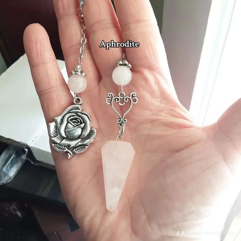 Deity pendulums and other designs 🌜 I am currently on a pendulum kick and here are just a few of the designs that I have dropped today as well as some that will be dropping soon #witchtok #divinationtok #artemis #aphrodite #themorrigan #loki #dionysus Pagan Jewelry, Goddess Of Love, Aphrodite, Witch, Crystals, Design