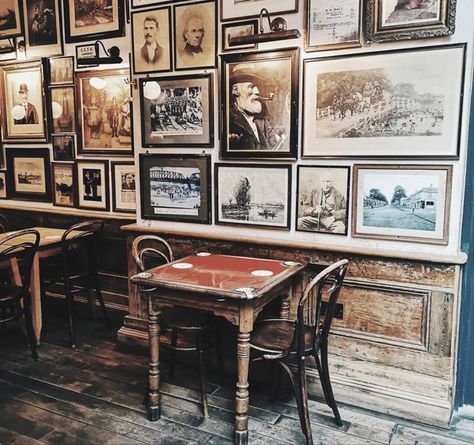 Photography on walls of Irish Pub Irish Restaurant Design, Irish Pub Inspired Basement, Seaside Pub Interior, Irish Pub Wall Decor, Pub Astethic, Bar Interior Design Pub, Pub Style Kitchen, Country Pub Interior, Irish Pub Aesthetic