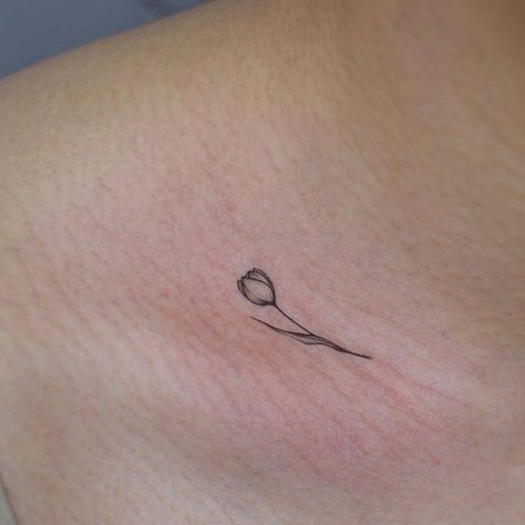 Tulip Tattoo Ideas Design, Small Tulip Tattoo Behind Ear, Tulips Fine Line Tattoo, Tulip Tattoo With Initials, Small Fine Line Tulip Tattoo, Tulip Tattoo Collar Bone, Tulip Simple Tattoo, Tulip Tattoo Finger, Tulips Minimalist Tattoo