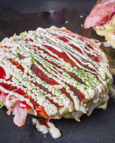 Okonomiyaki Recipe (Japanese Savory Cabbage Pancake). Comfort food from Japan, a savory, shredded cabbage pancake topped with kewpie mayo and sweet okonomiyaki sauce. It makes a quick and easy dinner on a weeknight. Asian Cabbage Pancakes, Korean Cabbage Pancake Recipe, Japanese Scallion Pancake, Yamitsuki Cabbage, Savory Cabbage, Cabbage Pancakes Okonomiyaki Sauce, Okonomiyaki Recipe, Okonomiyaki Sauce, Kewpie Mayo