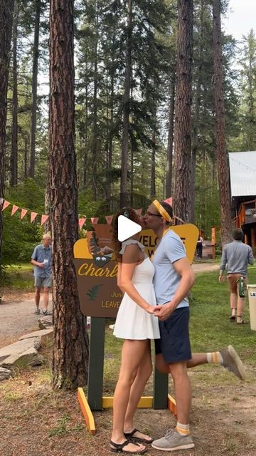 Charlotte Erin Massey on Instagram: "One of my favorite parts of our camp themed wedding was our welcome party!   Tom and I really wanted to get the party started as soon as guests arrived to the venue, and help our guests start meeting new friends as early as possible.   We had two friends serve as “camp counselors” for rival summer camp-style teams, which were designated by whether you chose a gold or green bandana that I designed as your wedding favor. Our guests really got into the fake rivalry, and the bandanas added an easy point of connection early in the wedding weekend!   The camp counselors were also in charge of checking everyone in as they arrived and making sure they knew the schedule and where they were sleeping. The check-in process worked especially well because it also gav Mess Hall Camp, Summer Camp Wedding Weekend, Camp Wedding Theme, Adult Summer Camp Theme Party, Summer Camp Wedding Theme, Summer Camp Theme Party, Silver Briefcase, Summer Camp Wedding Ideas, Camping Theme Wedding