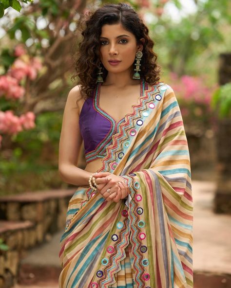 Upgrade your saree collection with our stunning multicolor striped printed saree, featuring elegant bold mirror work embroidery. Perfect for any occasion, this saree will make you stand out with its unique design and eye-catching colors. Elevate your style and make a bold statement with this one-of-a-kind saree. #sujatra #sujatraglobal #sujatrasarees #stripedsaree #printedsaree #multicolor #multicolorsaree #mirrorwork #mirrorembroidery #embroideredsaree #modernsaree Mirror Work Embroidery, Blouse Necklines, Floral Print Sarees, Modern Saree, Saree Trends, Printed Saree, Stylish Sarees, Chaniya Choli, Abstract Drawings