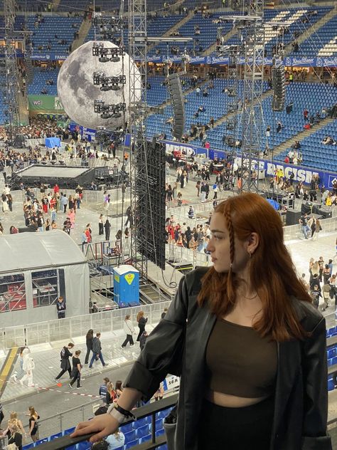 Me wearing a brown Top paired with a leather blazer. My hair is ginger and two strands of hair are braided in the front. In the background you can see the arena where the weeknd performed and you can see an inflatable moon. Weeknd Concert Outfit, The Weeknd Concert Outfit, The Weeknd Concert, Weeknd Concert, Hamburg Germany, The Weeknd, Concert Outfit, Germany, Concert