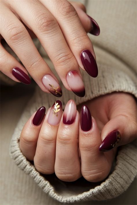 Embrace the cozy vibes of autumn with these elegant gel nails that showcase the perfect fall nail ideas. Featuring rich burgundy hues, delicate gold accents, and a chic matte finish, this design captures the essence of the season. Whether you're enjoying pumpkin spice lattes or cozying up by the fire, these nails will elevate your fall look. Get inspired and bring a touch of autumn to your manicure! #FallNailIdeas #GelNails #AutumnManicure Maroon Autumn Nails, Red Wine Nails Design Burgundy, Wine Red And Gold Nails, Fall Builder Gel Nails, Fall Wine Nails, Autumn Nails Biab, Latte Nail Ideas, Ombre Fall Nail Designs, Wine Red Nails Acrylic