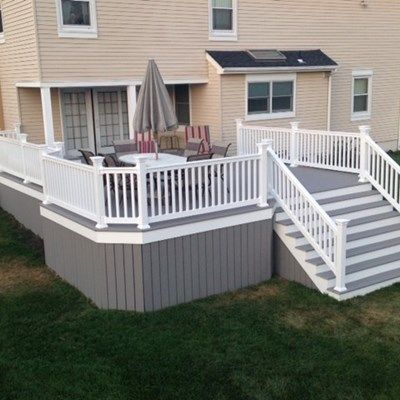 Gray Timbertech skirted deck Deck Skirting Ideas, Lattice Deck, Skirting Ideas, House Skirting, Front Porch Deck, Deck Building Plans, Deck Skirting, Deck Colors, Building A Porch