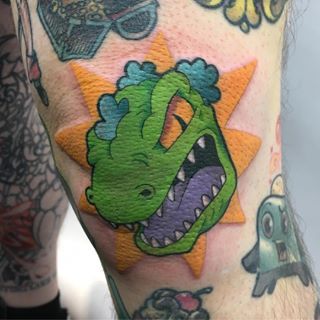 Reptar for Brian’s knee today! I loved the Rugrats and would love to do more tattoos like this! Also a huge thank you to Brian for sitting so well for this!! What a difficult spot! 😅 #rugrats #reptar #jessicavtattoos #cartoontattoo #cartoontattoos #rugratstattoo #reptartattoo Reptar Tattoo, Rugrats Tattoo, Stitch Tattoo, Kawaii Tattoo, London Tattoo, R Tattoo, Knee Tattoo, New School Tattoo, Cartoon Tattoos