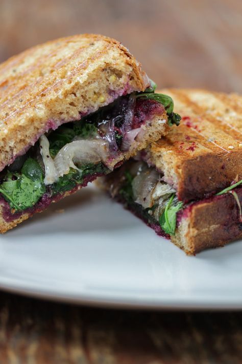 brie and blueberry jam panini - tasty seasons | brie and blueberry jam panini pairs sweet blueberry, melty brie, tangy shallots, and bitter arugula into a balanced and easy sandwich. Vegetable Lunch, Blueberry Jam Recipe, Easy Sandwich, Jam Sandwich, Turnover Recipes, Panini Recipes, Blue Berry, Blueberry Jam, Simple Sandwiches