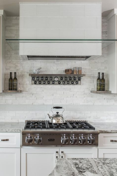 A magnetized spice rack above the cooktop in this high-end kitchen keeps herbs and spices within easy reach during cooking. Chalkboard labels are a fun and flexible way to tell them apart. Spice Rack Over Stove, Custom Kitchens Design, High End Kitchens, Contemporary Kitchen Design, Custom Kitchens, Custom Home Designs, Spice Rack, Custom Home Builders, Contemporary Kitchen