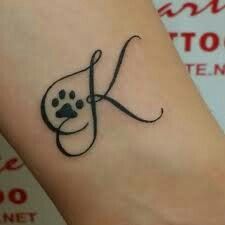 Paw Prints With Initials Tattoo, Paw Print Tattoo Dog Initial, Cat Initial Tattoo, Paw Print Initial Tattoo, Dog Initial Tattoo Ideas, Tattoos In Honor Of Dogs, Paw Print Tattoo With Initial, Dog Initial Tattoo, Dog Paw Tattoo Memorial