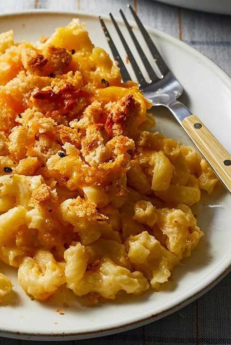 This Martha Stewart macaroni and cheese recipe is a classic—and sure to become a favorite with your family. It's a baked mac and cheese made with two cheeses. #easylunchrecipes #familydinner #familyfriendlyrecipes #marthastewart #recipeideas #recipes #weeknightdinners Americas Test Kitchen Macaroni And Cheese, Carla Hall Macaroni And Cheese, Martha Stewart Cheaters Mac And Cheese, French Mac And Cheese, Mac And Cheese Different Ways, Alton Brown Macaroni And Cheese, Mac And Chess, Martha Stewart Macaroni And Cheese, Celebrity Mac And Cheese Recipes