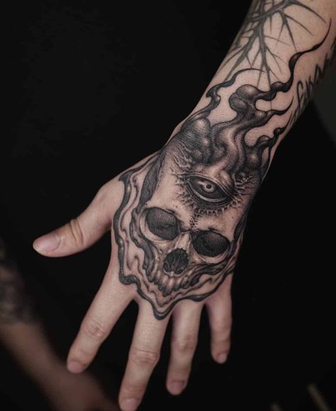 20 of the most potent hand tattoos for men you’ll ever see! - Body Artifact Hand Tattoos For Men, Traditional Hand Tattoo, Hand Tatto, Peach Tattoo, Skull Hand Tattoo, Reaper Tattoo, Demon Tattoo, Tattoo Hand, Bad Tattoos