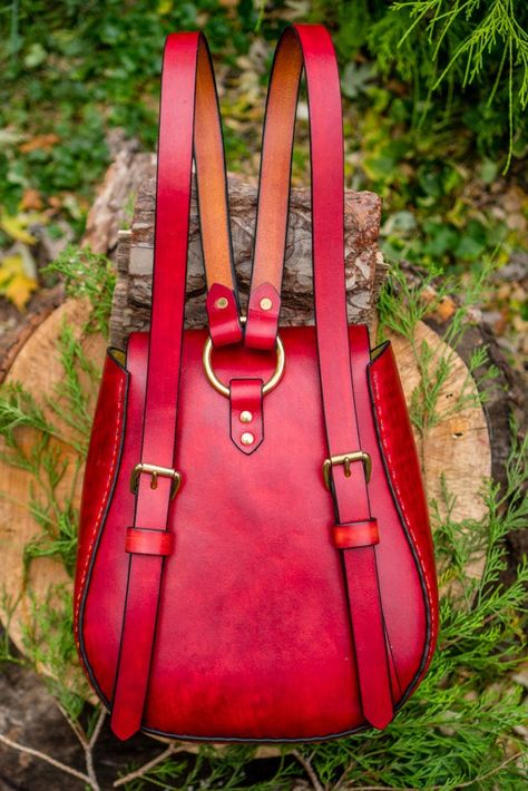 "Made to Order - Custom Order - Large Handmade Latigo Leather Backpack - Hand-dyed and hand-stitched - Solid Brass hardware - This special order leather backpack is constructed of 8 oz. special tanned yellow latigo and was hand-dyed a nice deep red with black trim. This hand-stitched bag is both elegant and rugged and will last a lifetime. Made to order, the variations are endless. Approximate measurements are: Length - 12\" at widest part, 10\" at the top Height - 13\" Width - 6.5\" at bottom, Leather Backpack Pattern, Leather Purse Pattern, Elegant Backpacks, Tan Backpack, Handmade Leather Work, Artist Bag, Handmade Leather Backpack, Unique Backpacks, Red Leather Bag