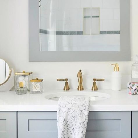 Delta Faucet on Instagram: "The muted blue vanity in @maria.decotiis’s bathroom is the perfect complement to the Champagne Bronze finish of the Cassidy faucet. Both bring rich color to the space, without overwhelming it." Delta Cassidy Champagne Bronze, Delta Champagne Bronze Bathroom, Champagne Bronze Bathroom, Delta Champagne Bronze, Delta Cassidy, Blue Vanity, Delta Faucets, Champagne Bronze, Bathroom Remodel Master