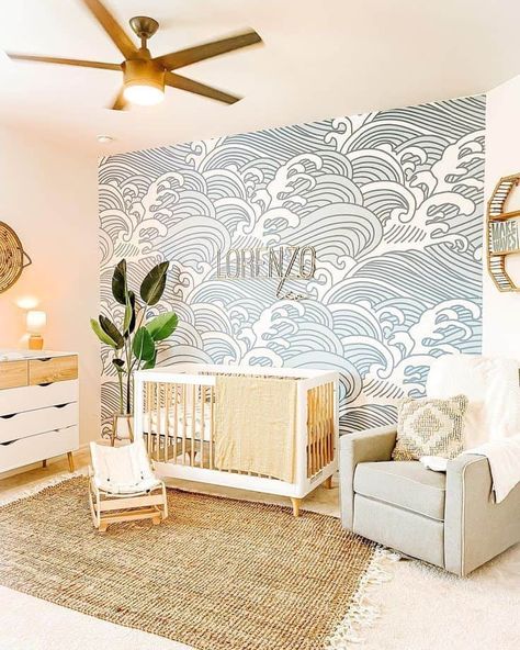 22 Calming Coastal Nursery Decorating Ideas » Lady Decluttered Nursery Ideas Ocean Sea Theme, Baby Boy Nursery Wave Wallpaper, Waves Nursery Wall, Waves Wallpaper Nursery, Ocean Wave Nursery, Modern Ocean Themed Nursery, Waves Nursery Theme, Wave Wallpaper Nursery, Surf Nursery Decor