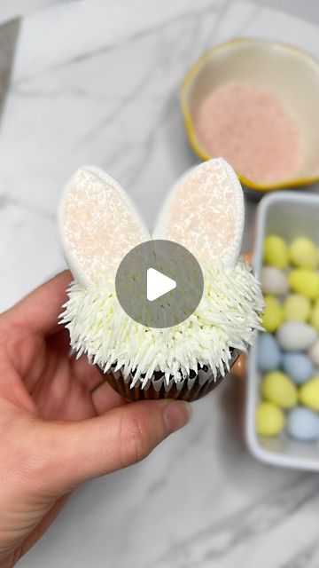 Jillian Vinion on Instagram: "Here’s a little tutorial for a fun way to make Easter bunny cupcakes using large marshmallows, sprinkles (any kind!), and the Wilton grass piping tip! Tip: I only had clear sugar sprinkles so I added them to a small bowl, mixed in a small drop of food coloring, and then (with gloves on) mixed them together to create light pink sprinkles. An easy way to create your own sprinkles if you don’t have the color you want/need!  . Food color brands: colour mill (for sprinkles!) Piping tips/nozzles: Wilton grass tip . . . #cupcakes #cupcake #cupcakesofinstagram #cakedesign #homemade #baking #howto #cakedecorating #bakingvideo #baker #bakerlife #dessertgram #caketutorial #cakevideo #bakinglife #tutorial #smallbusiness #lovecake #cakedecorating #easter #easterbunny #east Grass Piping Tip, Large Marshmallows, Easter Bunny Cupcakes, Pink Sprinkles, Piping Tip, Homemade Baking, Bunny Cupcakes, Baking Videos, Sugar Sprinkles