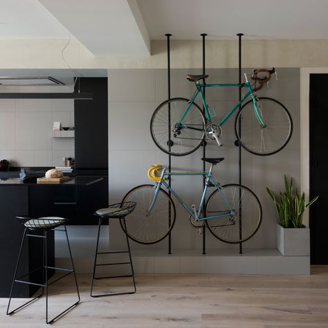 Bespoke storage creates room for bicycles in renovated Barcelona flat Bike Storage Room, Bike Storage Apartment, Indoor Bike Rack, Wall Mount Bike Rack, Bike Rack Wall, Apartment Walls, Bike Room, Barcelona Apartment, Bicycle Rack