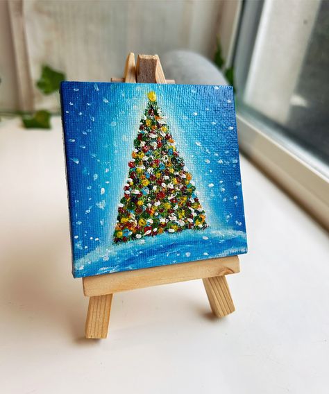 A beautiful Christmas tree in the snow mini canvas painting, the inspiration for this piece is Christmas time, finished with a layer of satin varnish to bring the colours to life. Bring some nature into the room with this acrylic painting.  The easel is included. Looking for the perfect painting for a home office, living room or as a gift? Look no further! You will receive a high quality acrylic painting. If you require a personalised/custom paint, please contact me. RETURNS There is a 30 day re Mini Canvas Paintings Christmas, Mini Christmas Paintings On Canvas, Small Christmas Paintings Mini Canvas, Mini Christmas Canvas Paintings, Mini Christmas Paintings, Christmas Mini Canvas, Mini Canvas Ornaments, Mini Canvas Christmas, Christmas Ornament Painting