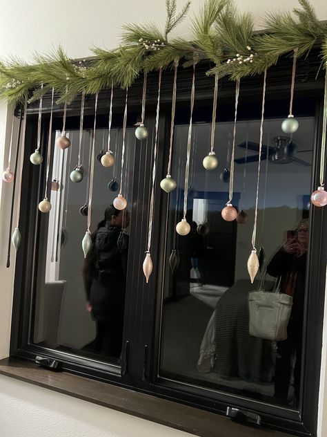 Christmas Balls Hanging From Window, Christmas Ornaments Hanging From Window, Christmas Window Baubles, Hanging Baubles Window, Christmas Ornament Hanging From Ceiling, Ornament Hanging From Ceiling, Ornaments In Window Hanging, Hanging Xmas Decorations From Ceiling, Christmas Hanging Decor Ideas