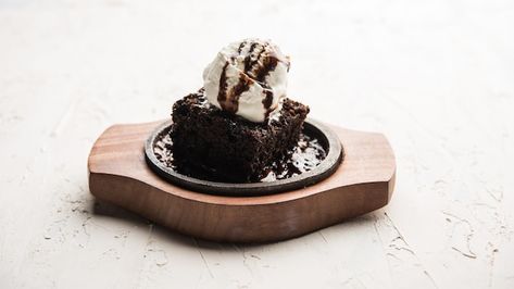 Sizzling chocolate brownie is a sweet di... | Premium Photo #Freepik #photo #chocolate-brownie #brownie #cake-table #dessert-cake Sizzling Brownie With Ice Cream, Sizzling Brownie, Brownie Ice Cream, Sweet Dish, Design Infographic, Ice Cream Toppings, Melted Chocolate, Dessert Cake, Brownie Cake