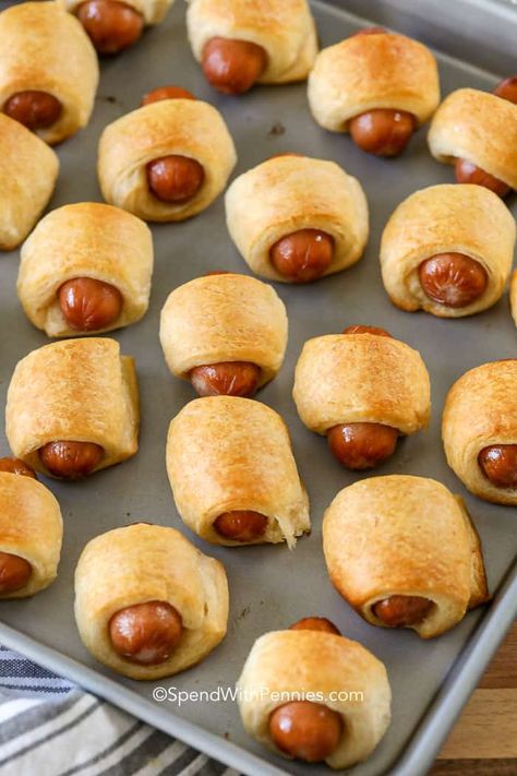 Pigs in a Blanket are so easy to make with just 2 simple ingredients, crescent rolls and mini smokies! We serve them with ketchup and mustard for the perfect easy 2 ingredient appetizer! #spendwithpennies #appetizer #easyrecipe #crescentrolls #crescentrollrecipe #partyfood #gameday Best Pigs In A Blanket Recipe, Elegant Canapes, Crescent Roll Recipes Appetizers, Ketchup And Mustard, Crescent Recipes, Appetizers For A Crowd, Appetizers Easy Finger Food, Crescent Roll Recipes, Finger Foods Easy