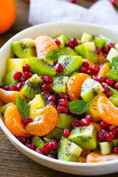 This winter fruit salad is a colorful variety of fresh fruit tossed in a light honey poppy seed dressing. Winter Fruit Salad, Resep Salad, Winter Fruit, Idee Pasto, Fruit Dishes, Fruit Salad Recipes, حلويات صحية, Läcker Mat, Dinner Salads