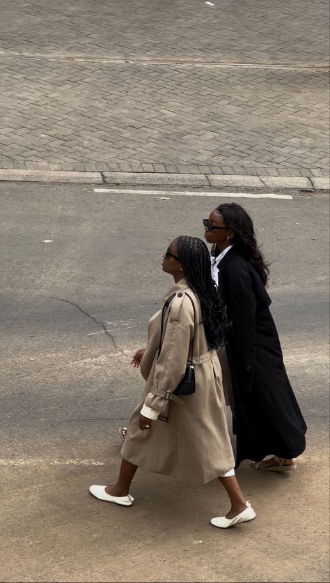 Birds Eye view of two black women  with braids and wavy hair  in a beige and black trench coats crossing the street in the city of Nairobi . Shot in an editorial fashion shoot style Scandinavian Clothing Style, Scandi Style Fashion, Black Girls Fashion, Black Coat Outfit, Trench Outfit, Nairobi City, Dump Pics, Trench Coat Outfit, Spring Semester