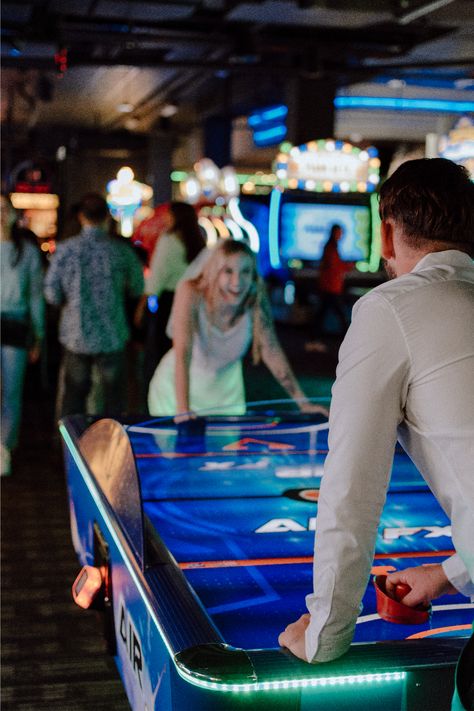 I had so much fun running around the arcade with these newlyweds! These San Diego fun wedding portraits are perfect Inso for outgoing couples. Get inspired by arcade couple photoshoot, arcade couple pictures, fun outgoing wedding photos, unique wedding photos, unique couple pictures, San Diego wedding photographer, Oceanside Ca photographer, Arcade engagement photos. Book Valerie as your photographer at https://valeriepenaphotography.mypixieset.com/contact/ Fun Pre Wedding Shoot Ideas, Wedding Arcade Games, Candy Shop Engagement Photos, Arcade Maternity Shoot, Roller Rink Engagement Photos, Nerdy Couple Photoshoot, Amusement Park Engagement Photos, Arcade Wedding Reception, Arcade Prewedding