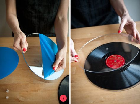 So awesome!   Items Needed:Records! (you can use 12″/10″/7″)Two pieces of clear plexiglass acrylic (cut to size, with a hole drilled directly in the middle)A sturdy base with a flat top (I used thrifted candlesticks)Clear screw fastener (I used 3/8 in. and cut them down a little for a perfect fit)A strong glue   Step One: Take the plastic off your freshly cut acrylic, and place one piece on each side of your record to make sure it fits. You’l... Record Garland Diy, Record Plates, Record Cake Stand, Cake Plates Diy, Soul Train Party, Record Cake, Diy Record, Vinyl Record Crafts, Record Crafts