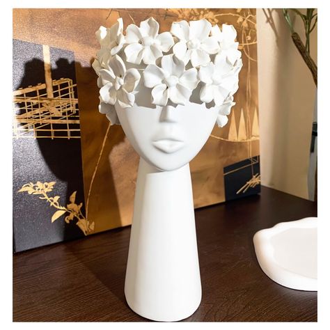 PRICES MAY VARY. Unique Sculptural Design: This ceramic head sculpture Vase with elegant female face and form wrapped in flowing details reminiscent of Greek statues for a focal point decorative accent. Versatile Decorating Piece: Standing over 11.5 inches tall, the white ceramic head can serve as an eye-catching centerpiece on tables. High Fired Ceramic Durability: Crafted from durable ceramic materials, the head is designed to withstand indoor and outdoor display and requires only occasional d Ceramic Bust Sculpture, Face Ceramics, Sculpture Female, Ceramic Bust, Sculpture Vase, Clay Decor, Sculpture Inspiration, Face Flower, White Centerpiece