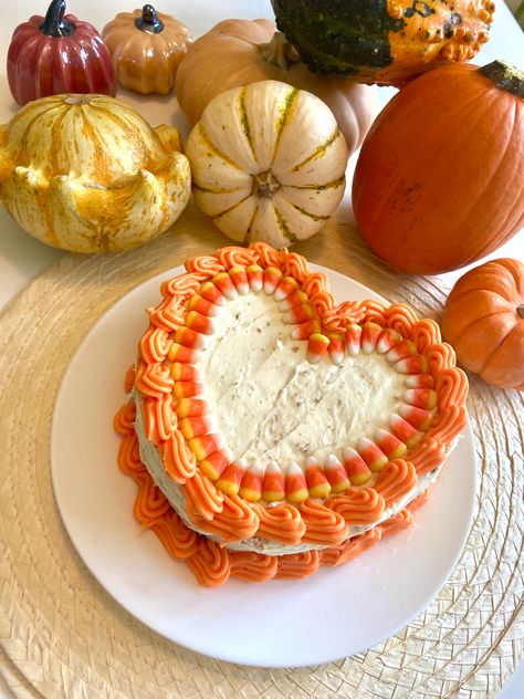 heart shape cake iced with white frosting and orange details. Decorated with candy corn for fall time Colorful Heart Cake, Orange Heart Cake, Halloween Heart Cake, Geo Heart Cake, Hart Shape Cake Designs, Heart Shaped Cakes, Heart Pin, Fall Cakes, Heart Cake