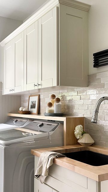 Laundry Room Design With Baskets, White Tile Backsplash Laundry Room, Laundry Room Zellige Tile, Subway Tile In Laundry Room, Tile For Laundry Room Wall, Tiled Wall Laundry Room, Tile Wall In Laundry Room, Laundry Room With Tile Backsplash, Laundry Room Upper Cabinet Ideas