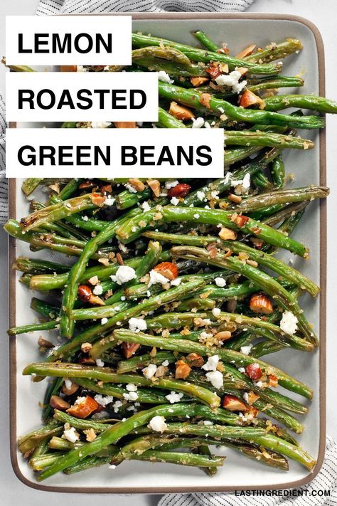 If you're looking for an easy side dish, you have to try these roasted green beans. Tossed in a crunchy mix of toasted breadcrumbs, almonds and sunflower seeds, they have lots of fresh flavors with lemon and crumbled feta. This recipe might even have you skip the green bean casserole and do some roasting instead. Whipped Feta Green Beans, Roasted Green Beans Thanksgiving, Healthy Roasted Green Beans, Lemon Butter Green Beans, Roasted Green Beans With Almonds, Oven Roasted Green Beans, Vegetarian Side Dish Recipes, Green Beans With Almonds, Green Beans Side