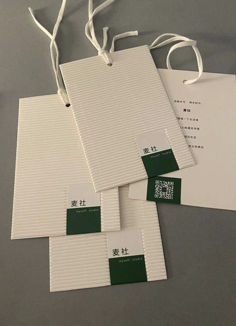 Textured paper hang tags with cotton string made of corrugated paper, another marketing tool for brand identity. Tag Design Ideas, Trim Tex, Hang Tag Design, Corrugated Paper, Fashion Sketchbook, Cotton String, Textured Paper, Tag Design, Paper Tags