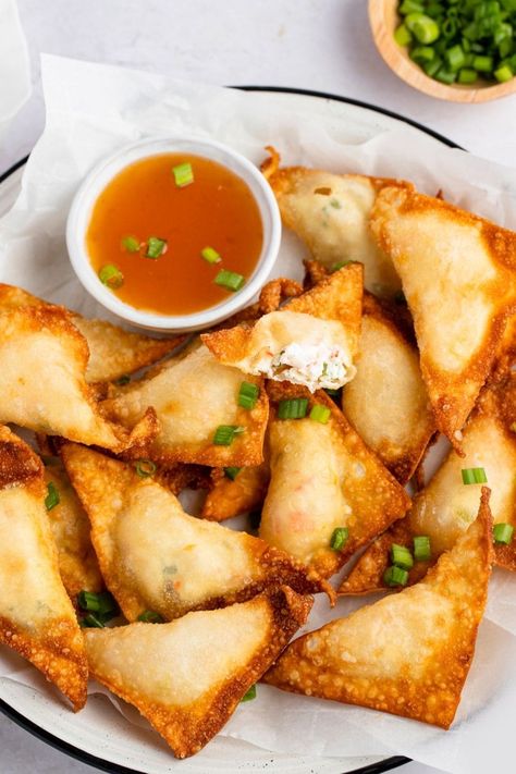 If you love crab rangoon, then you'll adore lobster rangoon! Learn how to make this easy recipe, plus, get tips for the best rangoon every time. Lobster Rangoon, Deep Fried Wontons, Lobster Appetizers, Lobster Cake, Seafood Meals, Bite Size Snacks, Creamy Parmesan Sauce, Crab Rangoon, Healthiest Seafood